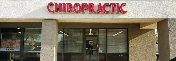 Exterior view of a chiropractic clinic storefront with large windows